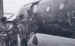 Soldiers about to depart with the Second Lift admire the decorated fuselage of their Horsa