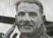 Lieutenant Bob Midwood applying camouflage cream